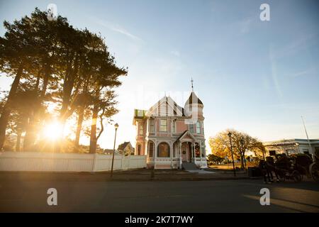 Sunset view of a row of historic Victorian homes in downtown Eureka, California, USA. Stock Photo