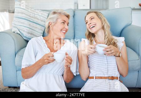 Coffee, comic communication and mother with daughter on the living room floor of their house. Elderly woman speaking, giving advice and in Stock Photo
