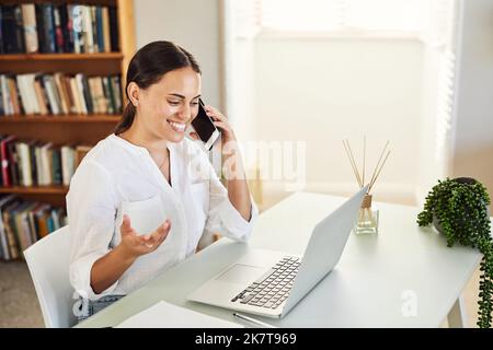 Im so excited about this venture. a young businesswoman using her smartphone to make a phone call. Stock Photo