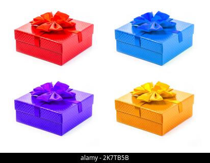 Set of gift boxes on white background. Crafts from needlework and colored paper, decorated with satin ribbon bows Stock Photo