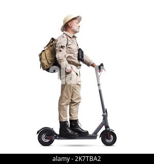Confident vintage style explorer riding an electric scooter, isolated on white background Stock Photo