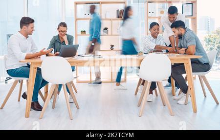 Busy, office and employees working in collaboration, meeting and talking about corporate work. Fast, professional and coworking business space for Stock Photo