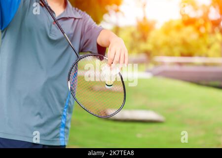 hand serve badminton shuttlecock outdoor sport playing relax holiday fun activity concept Stock Photo