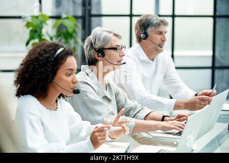 customer service manager working in the call center office. Stock Photo