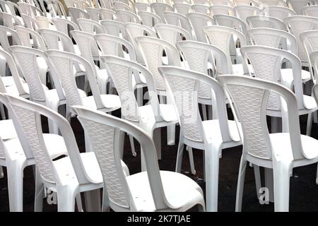 Rows of white seats. Empty chairs in the conference hall. Stock Photo