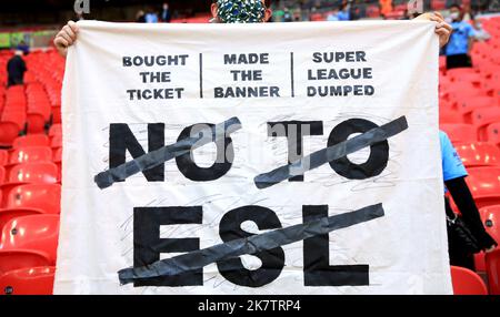 File photo dated 25-04-2021 of A fan in the stands holds up a banner protesting against the European Super League. A new European Super League with no permanent membership could be up and running by the 2024-25 season, the chief executive of the company behind the failed project has revealed. Bernd Reichart has been hired by A22 Sports Management, which was formed to sponsor and assist in the creation of the proposed 12-team breakaway league in April last year. Picture date: Sunday April 25, 2021. Issue date: Wednesday October 19, 2022. Stock Photo