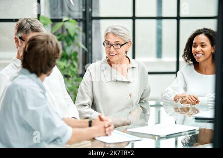group of business people discussing the terms of a new contract. Stock Photo