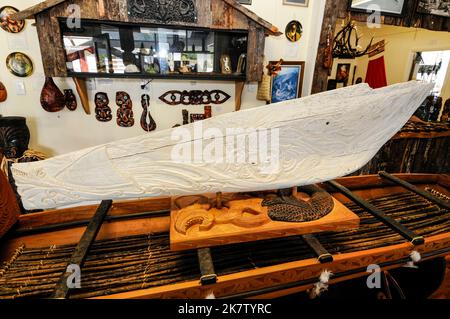 A whalebone jaw which is 3,500 years old and hand-carved on display at the Kotuku Maori art and crafts gallery in the small town of Whataroa in South W Stock Photo