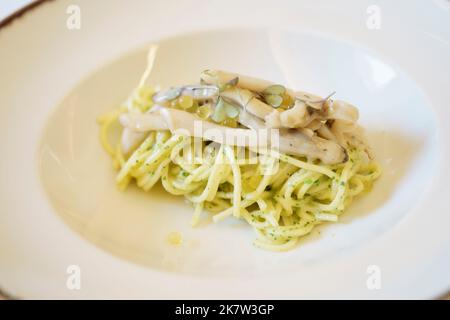 Pasta dish served on white plate Stock Photo