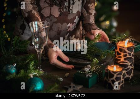 Woman preparing festive place setting Stock Photo