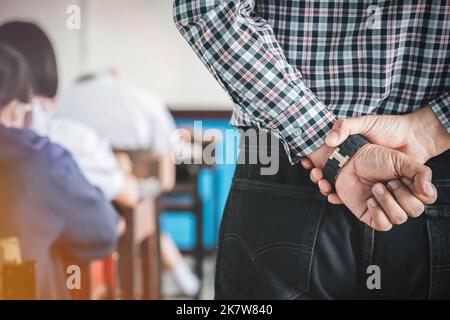The teacher controls the exam room for students to take the exam in the classroom Stock Photo