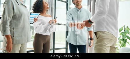 happy business colleagues shaking hands. concept of cooperation. Stock Photo