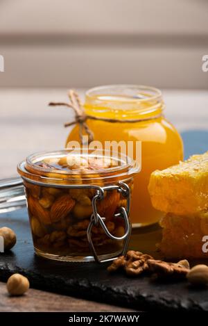 Honey in a glass jar with nuts and fruits for sell for tourist in