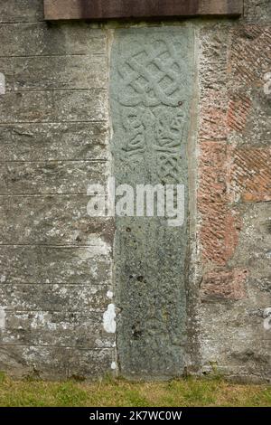 Ancient graveslabs built into the wall of Strachur Church, Argyll, Scotland Stock Photo