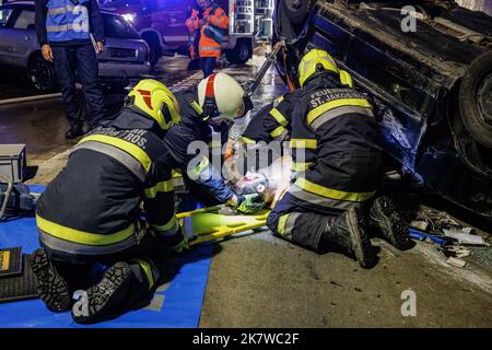Austrian firemen tend to an accident casualty at a staged traffic ...