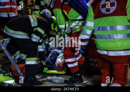 Austrian firemen tend to an accident casualty trapped inside an ...