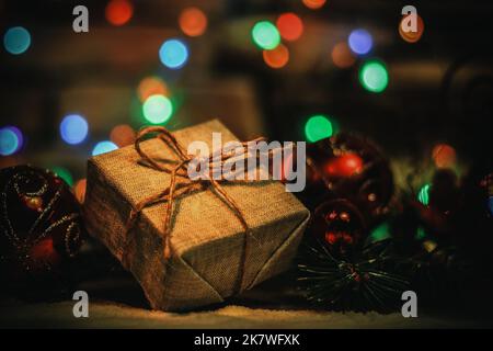 Christmas present on the background of Christmas lights Stock Photo