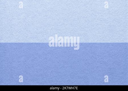 Texture of craft light blue and very peri paper background, half two colors, macro. Structure of vintage dense denim cardboard. Felt lavender backdrop Stock Photo