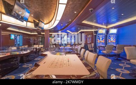 View of the casino and gaming tables inside the Costa Smeralda cruise ship in the port of Marseille, France on 02/10/2022. Stock Photo