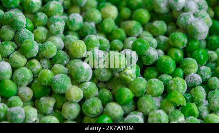 Frozen green peas texture background. ice peas background for food textures. Raw vegetables Stock Photo