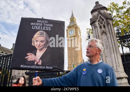 London, UK. 19th October 2022. A protester holds an anti-Liz Truss placard outside Parliament as Truss faced Prime Minister's Questions (PMQs). Credit: Vuk Valcic/Alamy Live News Stock Photo