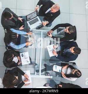 business team using a laptop to analyze financial data Stock Photo