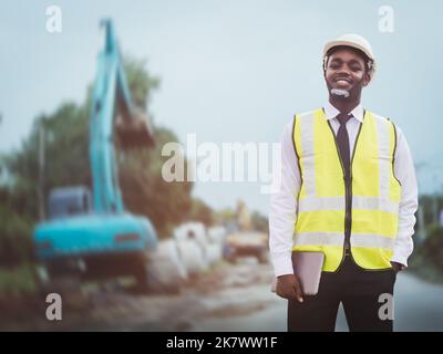 African Architecture engineer man holding a tablet for working on the road construction site and   inspection project road construction development Stock Photo