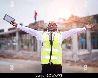 African architects engineer man with tablet work together in the inside the construction building site Stock Photo