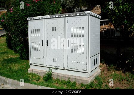 Close up Grey Hinged Power Supply Box on the street. Outside electrical box Stock Photo