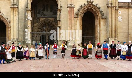 A folk dance group in traditional costumes preparing to dance in front of Oviedo cathedral during the Disarmament Parties 15 October 2022 Spain Stock Photo