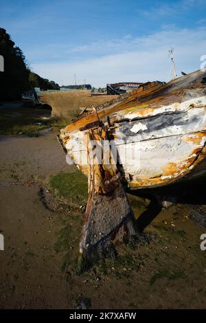 Stern detail of abandoned boat at Pin Mill on the river Orwell near Ipswich, which is a graveyard to wooden sailing boats Stock Photo