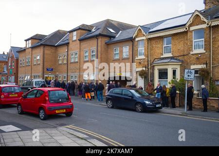 Queue of people waiting to have their Covid and or Flu jabs outside the Brook Square surgery in the centre of Scarborough, North Yorkshire Stock Photo