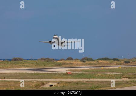 Aegean Airlines plane taking off. Diagoras aiport Rhodes. Blue sky with plenty of room for text. October 08, 2022, Rhodes, Greece Stock Photo