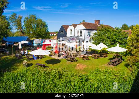 The Tickled Trout pub in Wye village.British pub featuring local fare, outdoor dining in riverside gardens & a rustic, old-world vibe.Wye,Kent,UK Stock Photo