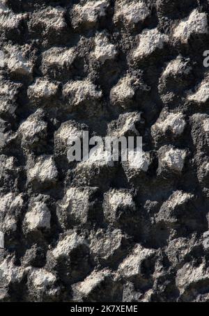 Black stones and rocks of different shapes. Stock Photo