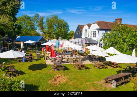 The Tickled Trout pub in Wye village.British pub featuring local fare, outdoor dining in riverside gardens & a rustic, old-world vibe.Wye,Kent,UK Stock Photo