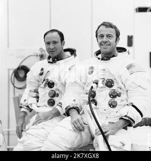 Astronauts Alan B. Shepard Jr. (right), commander, and Edgar D. Mitchell, lunar module pilot, are suited up for a manned altitude run in the Apollo 14 Lunar Module (LM). Stock Photo