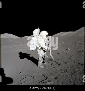 Scientist-astronaut Harrison H. Schmitt, Apollo 17 lunar module pilot, collects lunar rake samples at Station 1 during the mission's first spacewalk at the Taurus-Littrow landing site. Stock Photo