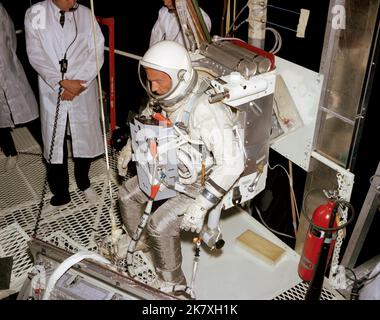 Astronaut Edwin E. 'Buzz' Aldrin, prime crew pilot of the Gemini XII spaceflight, undergoes evaluation procedures with the Astronaut Maneuvering Unit in the 30-foot altitude chamber at McDonnell Aircraft. The Astronaut Maneuvering Unit subsequently was deleted from the mission so Aldrin could demonstrate basic spacewalk capabilities required for Apollo missions.