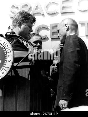 President John F. Kennedy pins a NASA Distinguished Service Medal on astronaut John Glenn Jr. following his historic three-orbit flight, Mercury-Atlas 6. The ceremony was held in front of Hangar S at Cape Canaveral Air Force Station. Stock Photo