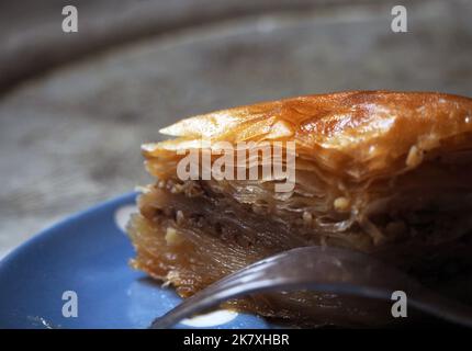 Closeup on the Turkish dessert, 80-ply dough baklava with walnut. Stock Photo