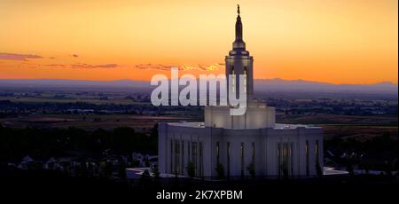 Pocatello Idaho LDS Mormon Latter-day Saint Temple with lights at sunset Angel Moroni Stock Photo