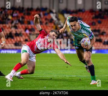 Tonga's Will Penisini (left) and Cook Islands' Kayal Iro in action