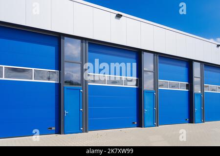 industrial unit with blue shutter doors Stock Photo