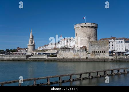 The city walls with the Lantern Tower and The Chain Tower at the entrance to the ancient port of La Rochelle, Charente Maritime Stock Photo