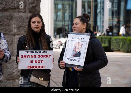 Birmingham, UK. 15th Oct, 2022. Ukrainian supporters demonstrating against RussiaÕs invasion and occupation of Ukraine outside Birmingham Town Hall, West Midlands, United Kingdom. Two women holding up posters condemning the Russian invasion of Ukraine.  Credit: NexusPix/Alamy Stock Photo