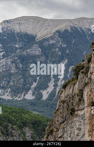 magnificent view of Spanish Pyrenees mountains with rock outcrops and forest covered slopes Stock Photo