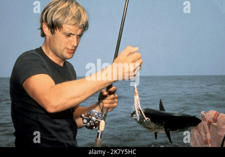 David Mccallum Catches Fish Film: The Heroin Gang (1968)   Director: Brian G. Hutton 07 February 1968   **WARNING** This Photograph is for editorial use only and is the copyright of MGM and/or the Photographer assigned by the Film or Production Company and can only be reproduced by publications in conjunction with the promotion of the above Film. A Mandatory Credit To MGM is required. The Photographer should also be credited when known. No commercial use can be granted without written authority from the Film Company. Stock Photo