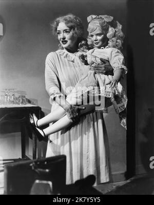 Bette Davis & Doll Film: What Ever Happened To Baby Jane? (USA 1962) Characters: Baby Jane Hudson &  Director: Robert Aldrich 26 October 1962   **WARNING** This Photograph is for editorial use only and is the copyright of WARNER BROS. and/or the Photographer assigned by the Film or Production Company and can only be reproduced by publications in conjunction with the promotion of the above Film. A Mandatory Credit To WARNER BROS. is required. The Photographer should also be credited when known. No commercial use can be granted without written authority from the Film Company. Stock Photo