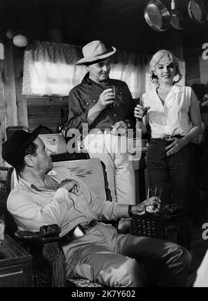 Eli Wallach, Clark Gable & Marilyn Monroe Film: The Misfits (1961) Characters: Guido,Gay Langland & Roslyn Taber  Director: John Huston 01 February 1961   **WARNING** This Photograph is for editorial use only and is the copyright of SEVEN ARTS and/or the Photographer assigned by the Film or Production Company and can only be reproduced by publications in conjunction with the promotion of the above Film. A Mandatory Credit To SEVEN ARTS is required. The Photographer should also be credited when known. No commercial use can be granted without written authority from the Film Company. Stock Photo